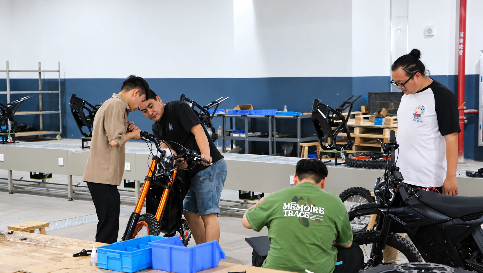 KMS technicians assembling motorcycles