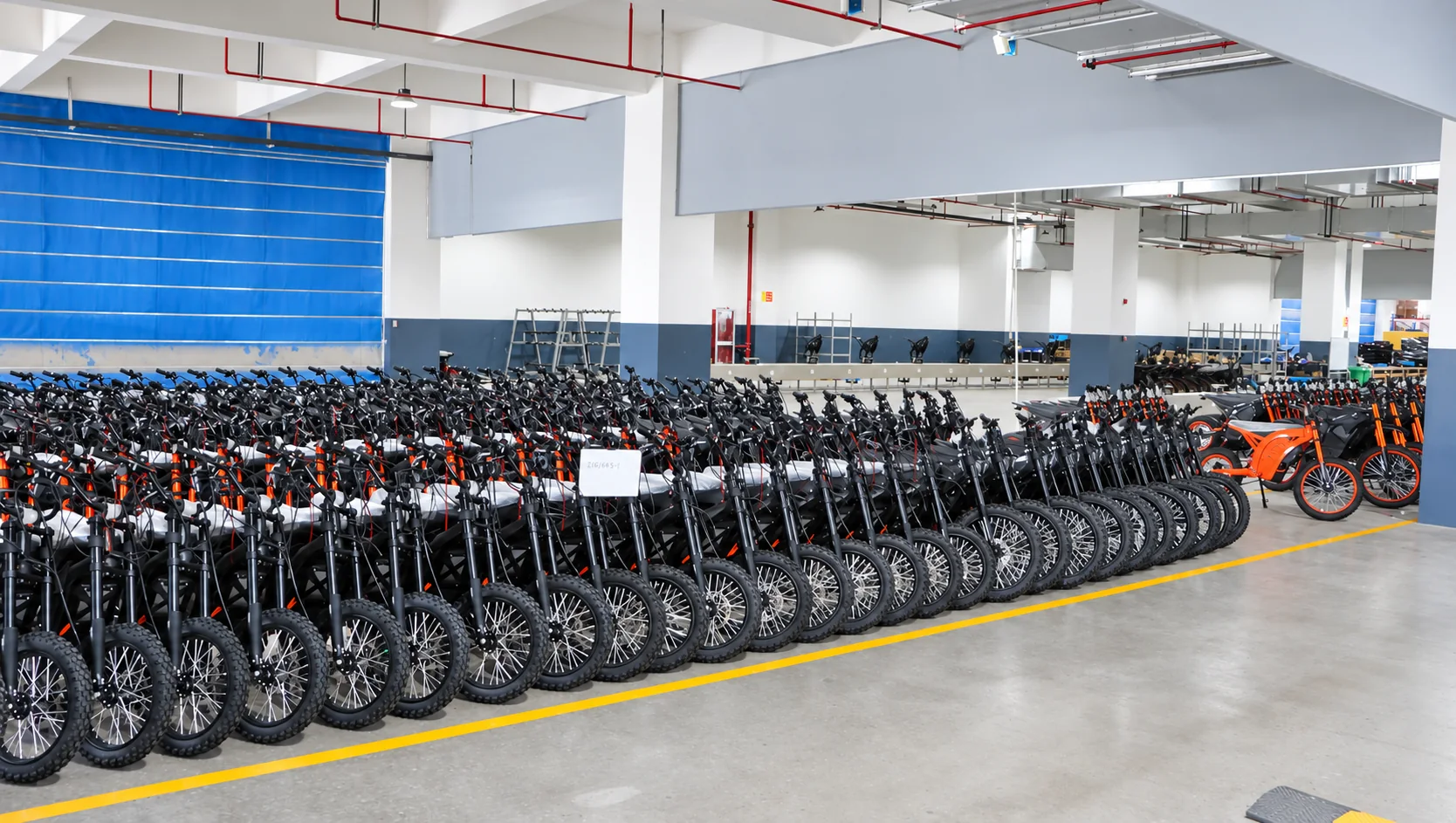 Rows of KMS motorcycles on the production floor